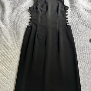 Black fitted midi dress with cut out chain link sides - size small